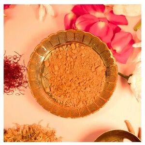 Ubtan paste with ingredients like turmeric, saffron, sandalwood and jasmine.